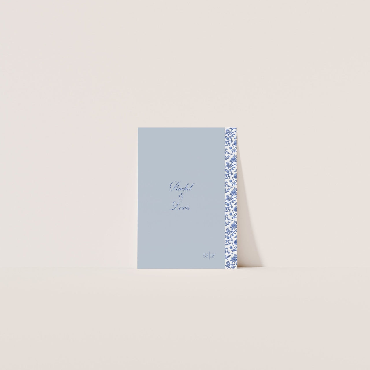 Editable Canva invitation cover with classic blue floral design and soft ivory background – Casa De Cielo suite